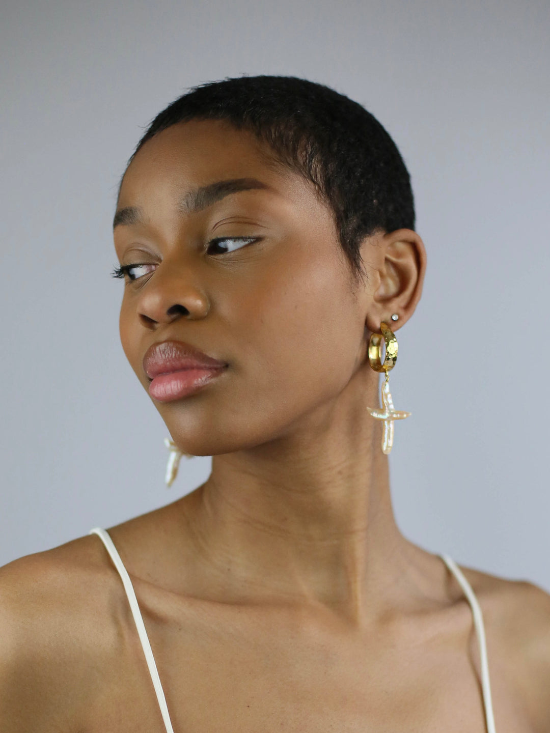 Adorn yourself with Charlotte Alegria's Cross My Heart Earrings