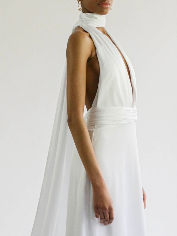 The plunging neckline, halter neck, and extra-long tie detail
