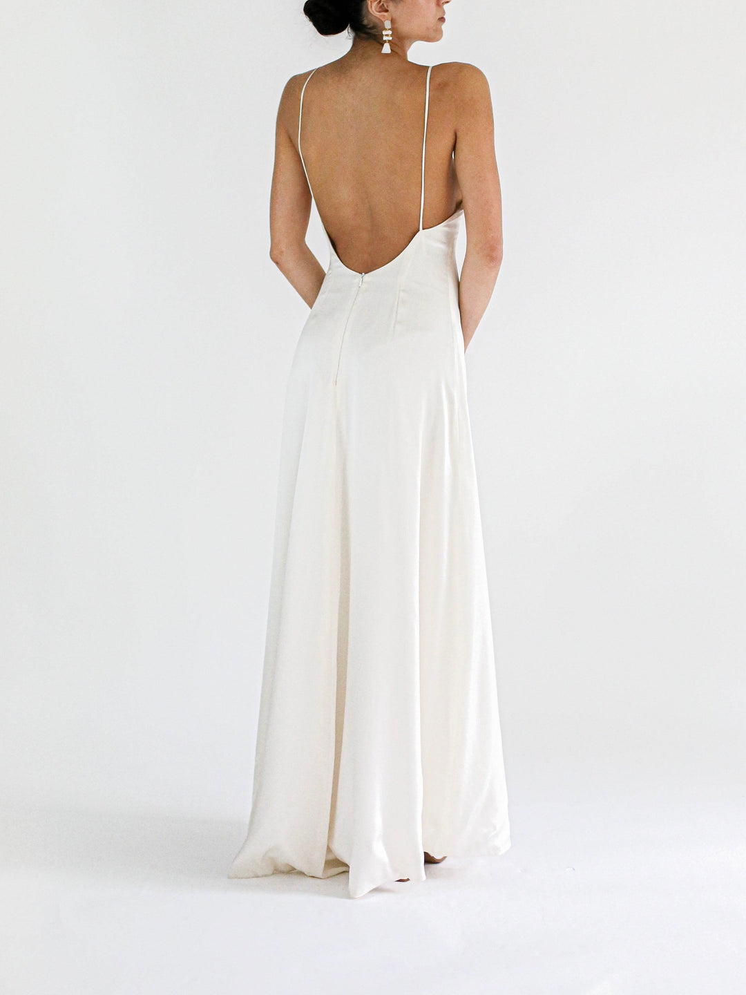 Model showing the back of the Amelia cowl wedding dress 