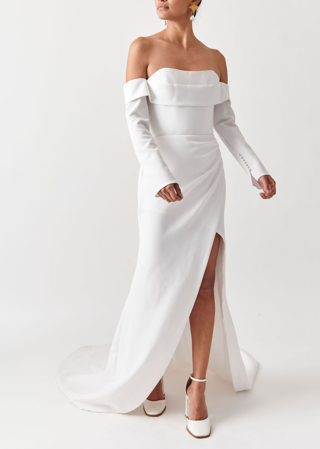 Turn heads in the Coco Off The Shoulder Long Sleeves Wedding Dress