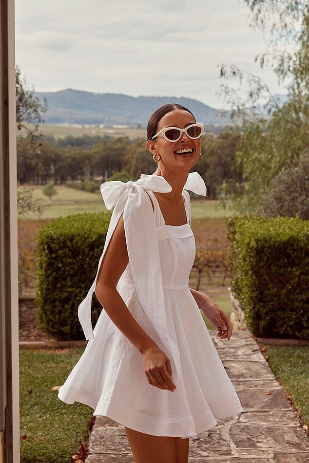 Model Wearing Aisle White Linen Bow Mini Wedding Dress