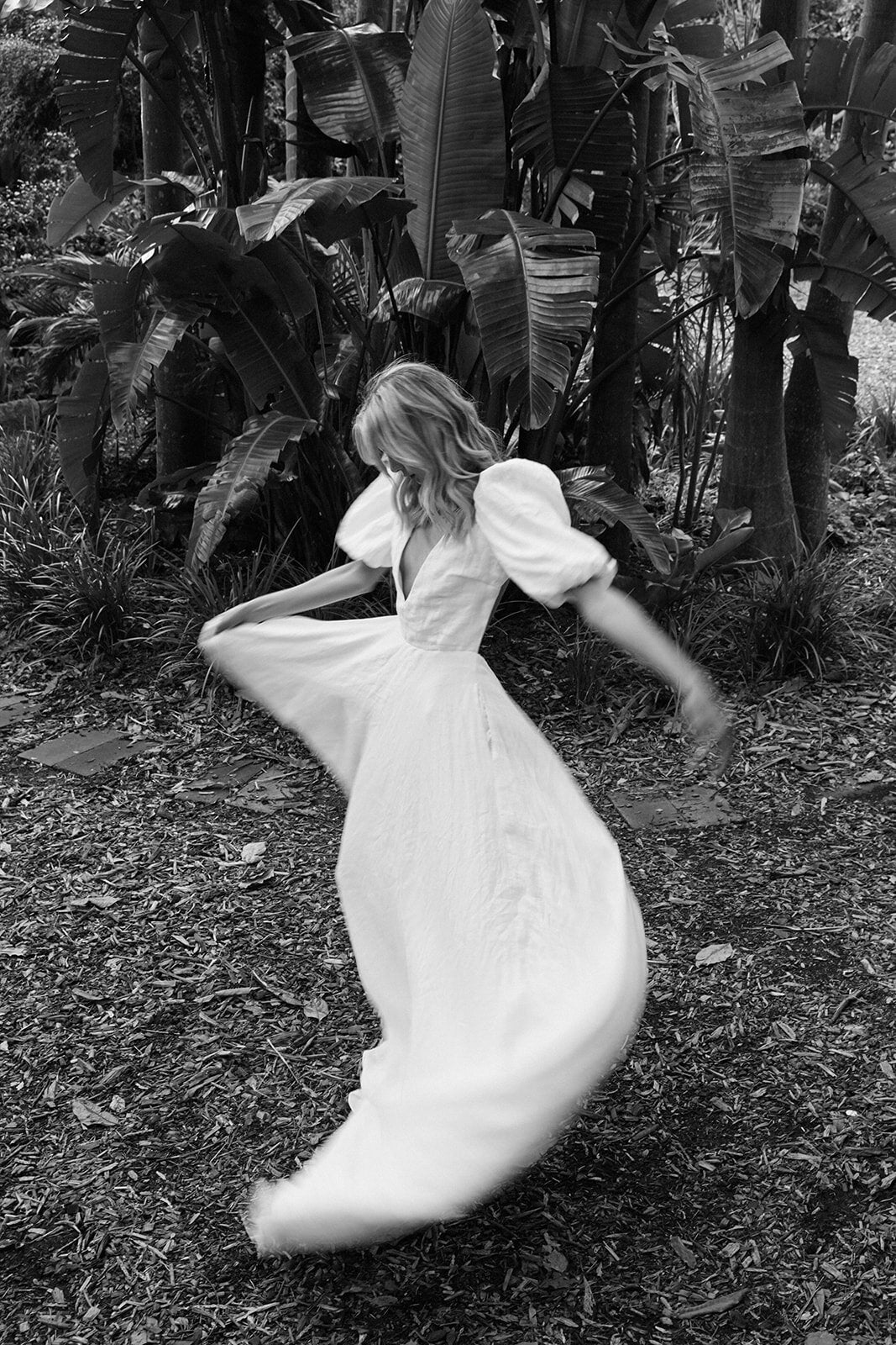 Model Twirling in Auldyn Modern Wedding Dress