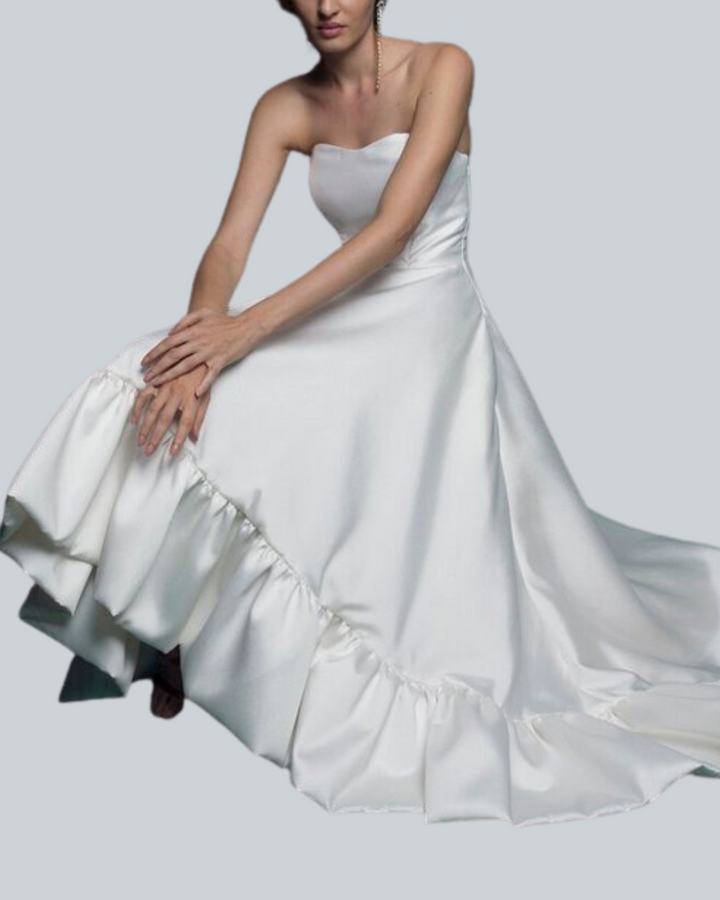 Model Sitting Wearing Atlantis Corset Strapless Wedding Dress