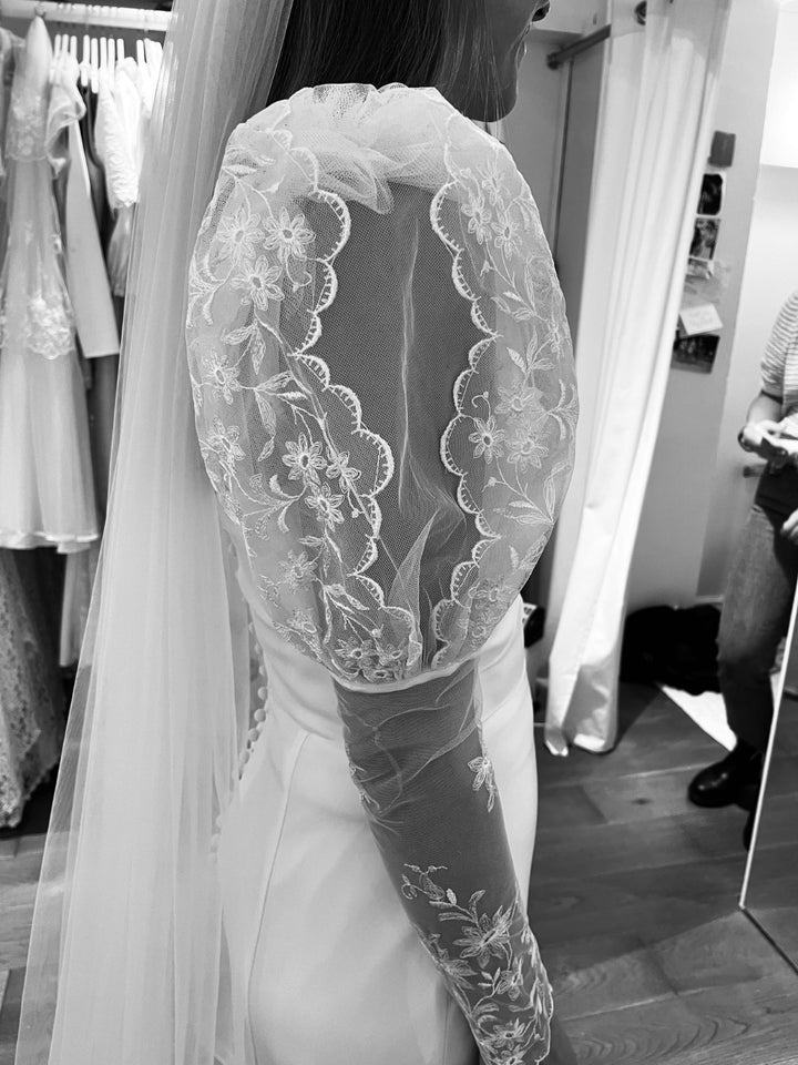 A side view of the removable vintage French lace puff sleeves