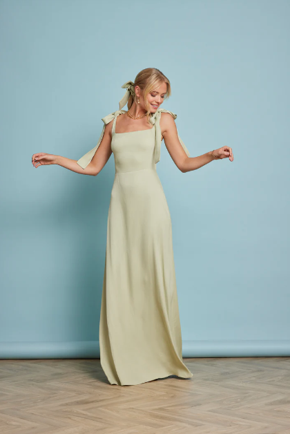 Front Profile of Model Wearing Allegra Sage Green Wedding Guest Dress