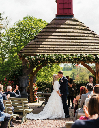 A side view of the Darcy Tara Long Sleeve Wedding Gown