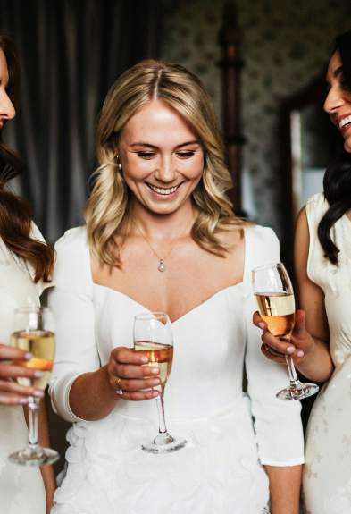 A close up view of the stunning neckline on this Darcy Tara gown