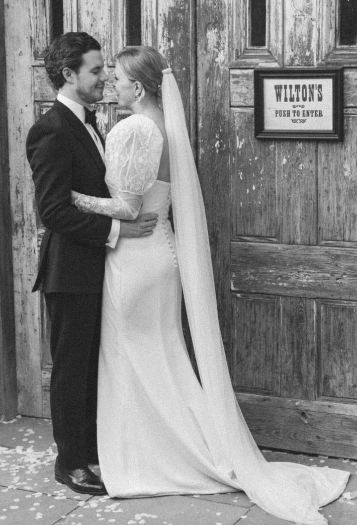 A side view of the Custom Mears Wedding Dress