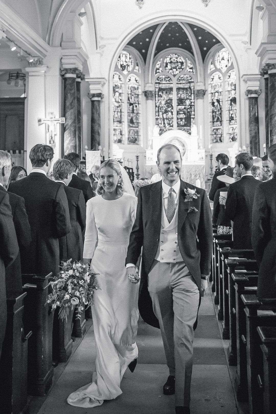 Model Wearing BB10 Long Sleeve Wedding Dress Walking Down Aisle