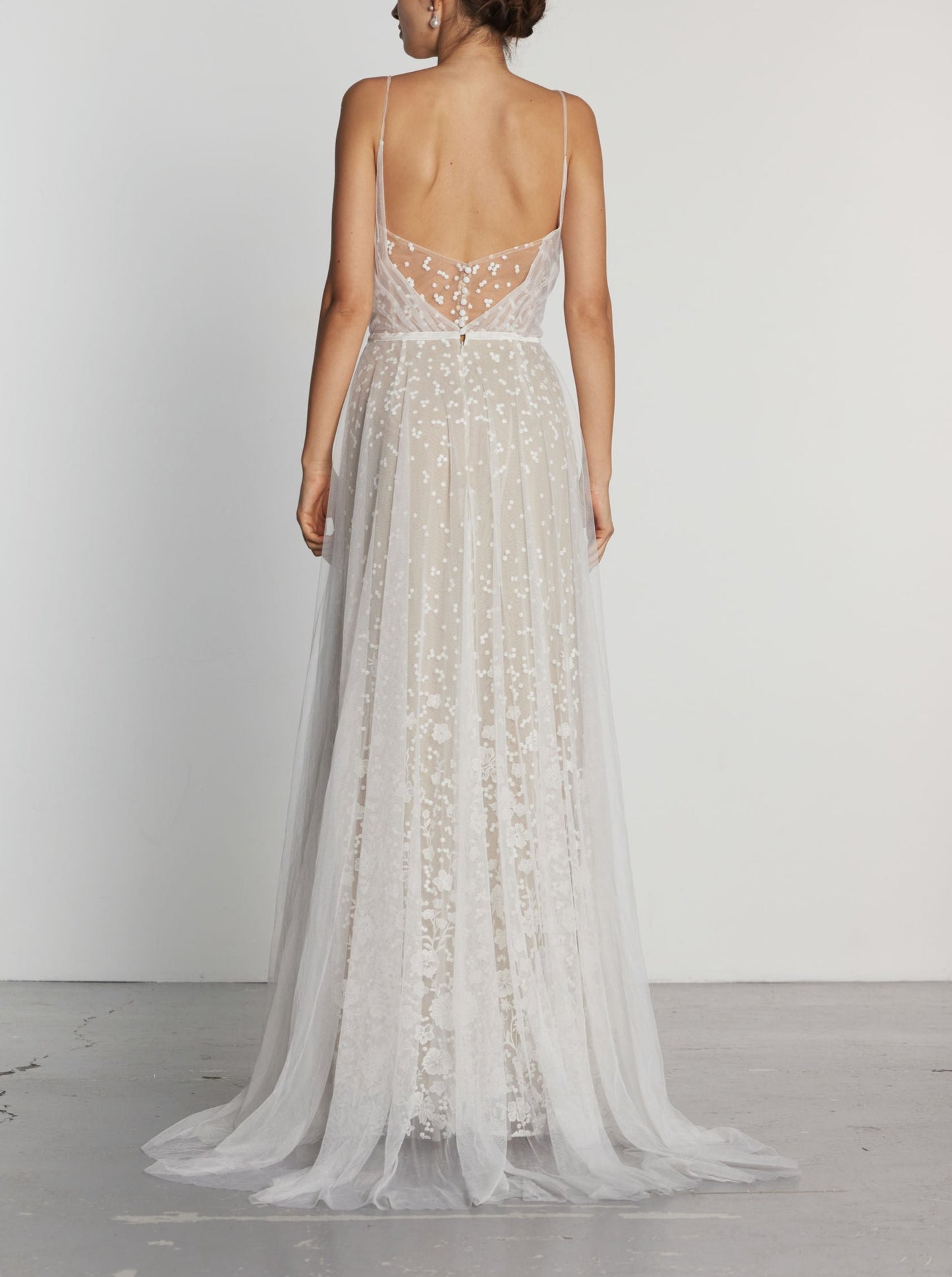 A back view of the Colden Floral Embroidery Lace Wedding Dress