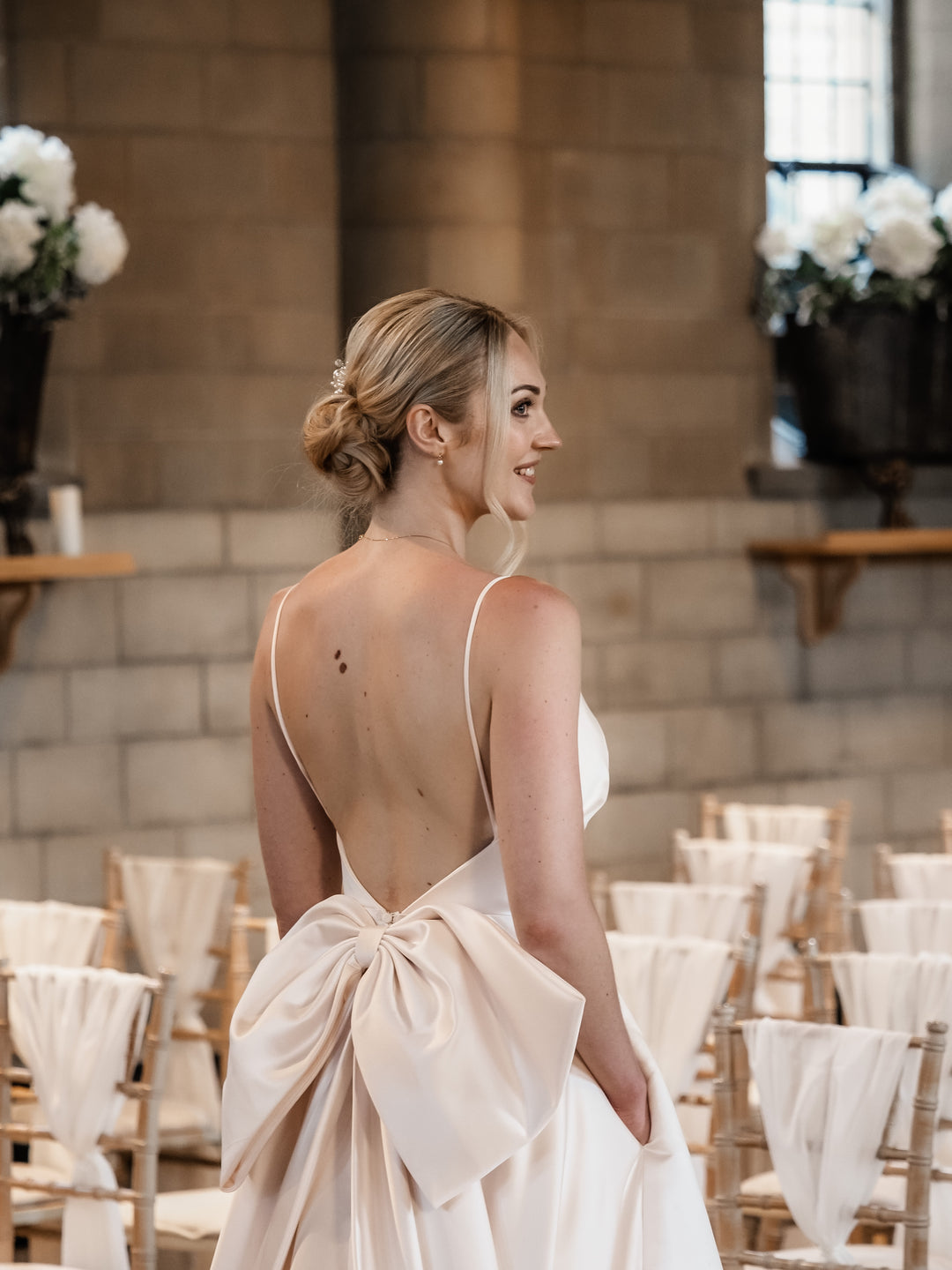 A close up view of the back of the Dove Empire Blush Dress